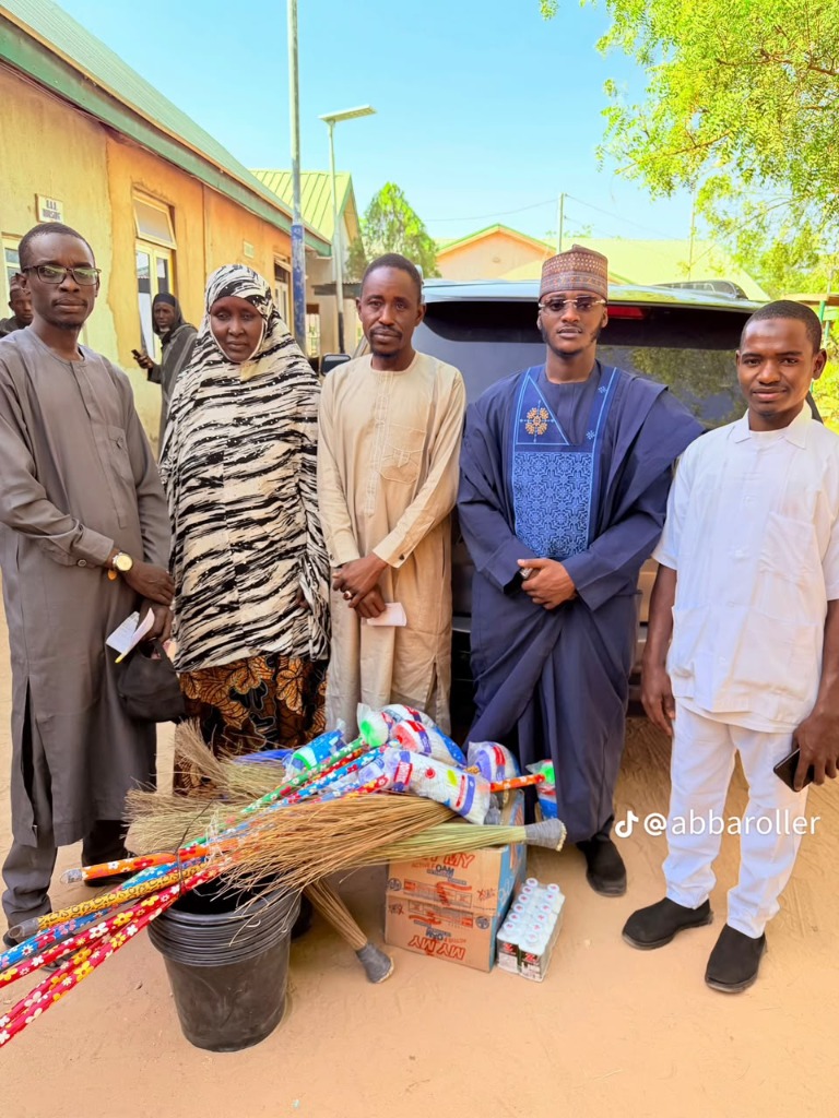 Hon. Usman Aminu Usman and Foundation team presenting cleaning supplies and patient support outside Gumel General Hospital