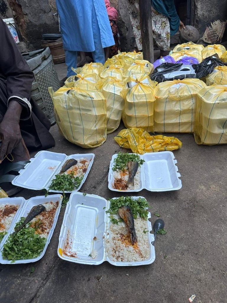Freshly prepared nutritious takeaway meal packs containing fish, seasoned rice, and fresh vegetables ready for ARF weekly distribution